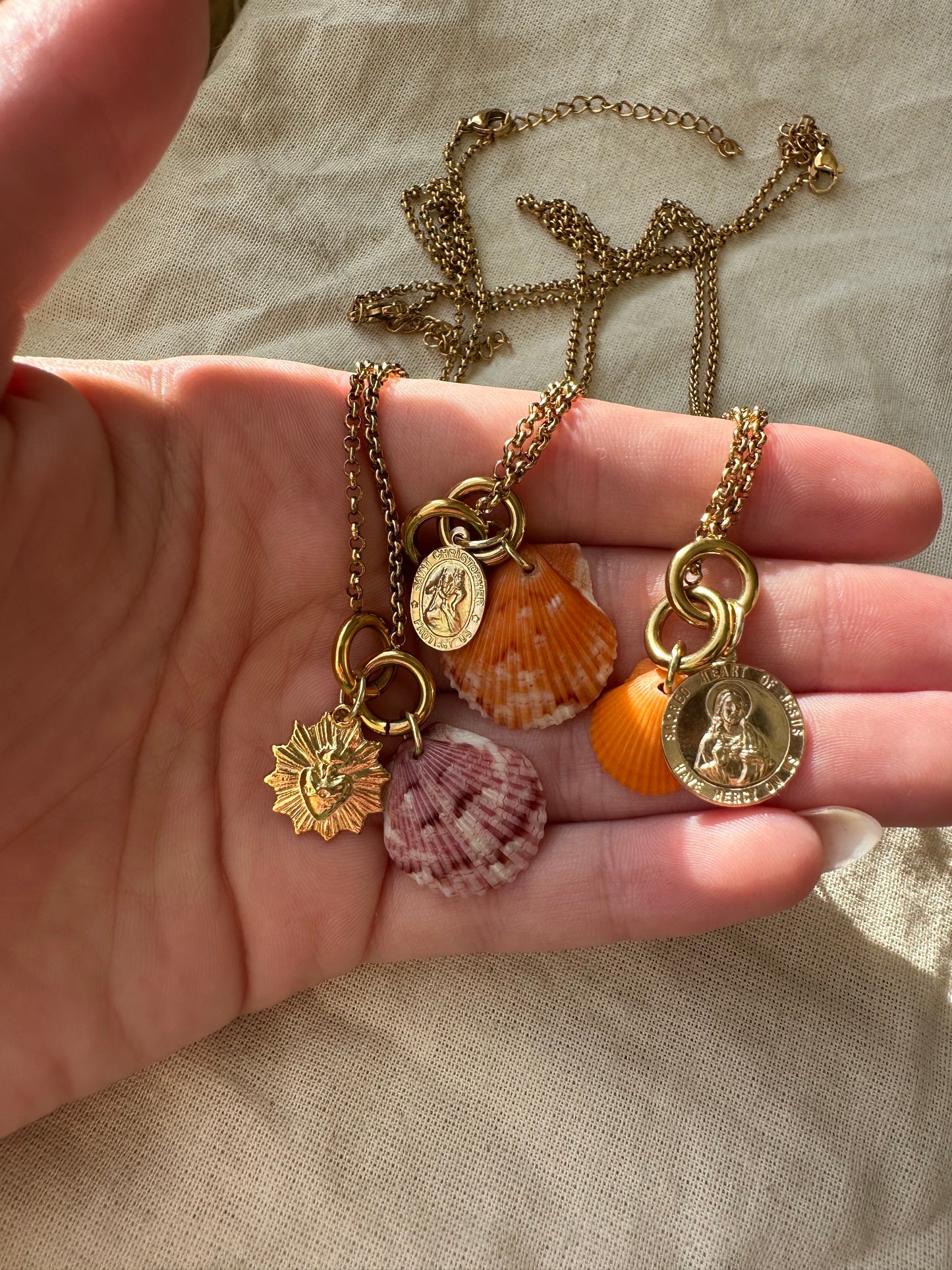 Gold Calico Shell Jesus Medallion Necklace