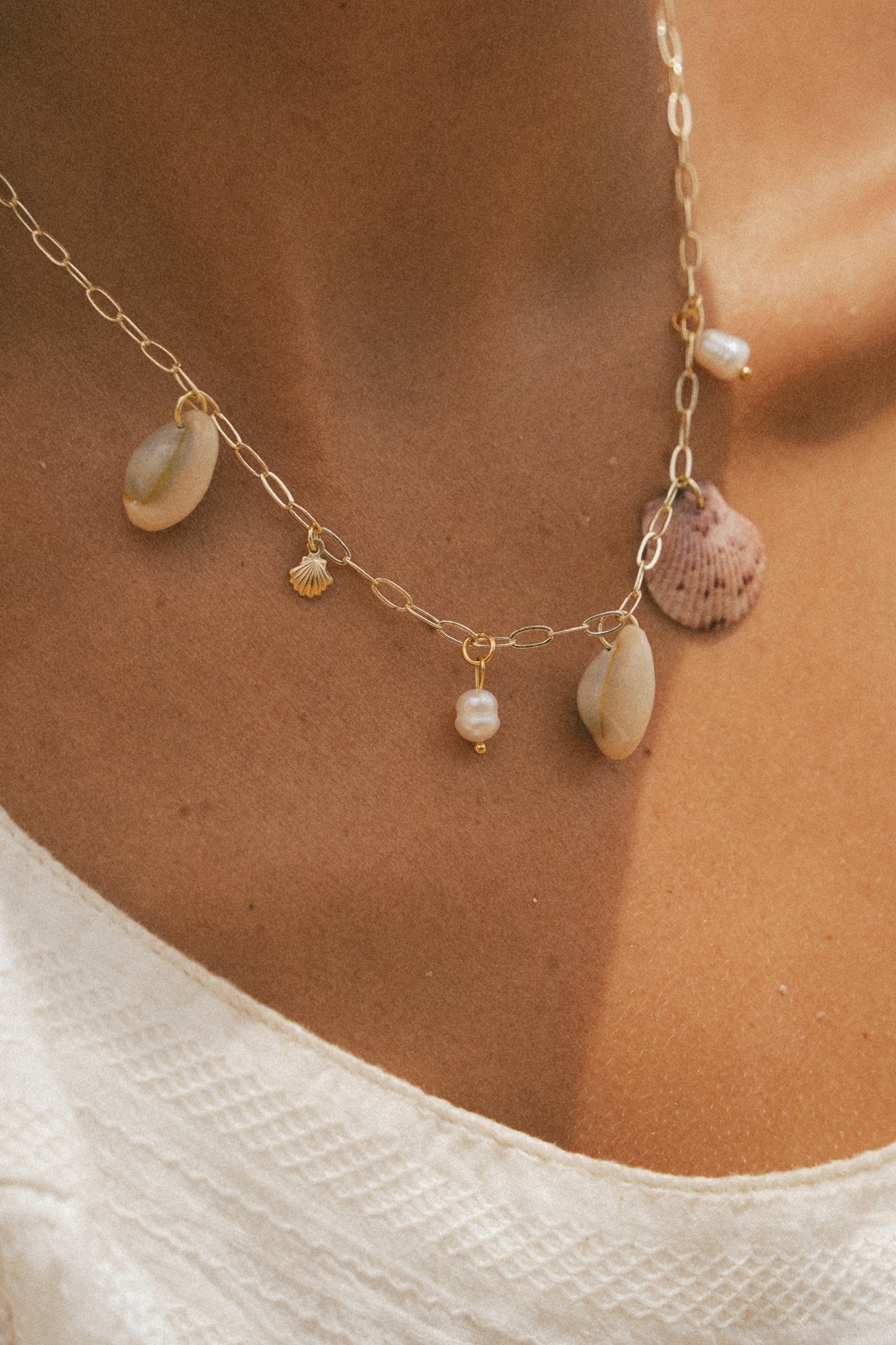 The Anini Gold Calico Shell Charm Necklace